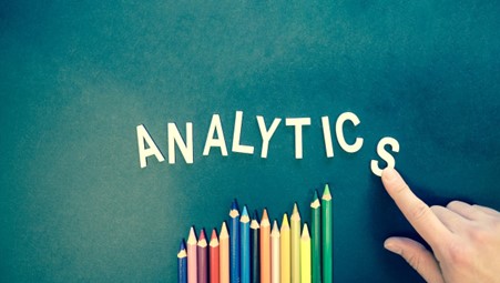 Alt-tag: The word “Analytics” above colored pencils 